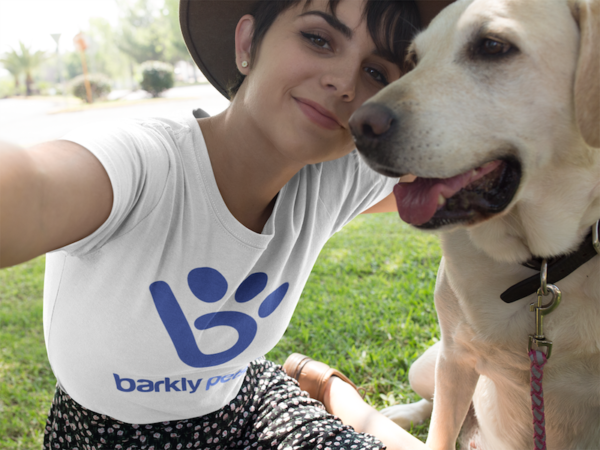 A Barkly dog walker taking a selfie with a yellow lab.